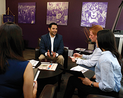 Grand Canyon University’s Eduardo Borquez speaks with MBA student Natalia Diaz (left) and undergraduate business students Gianni De Bruyn and Linette Fonsea at the Colangelo College of Business. Photo courtesy of Grand Canyon University