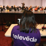 Televeda worker at a symphony